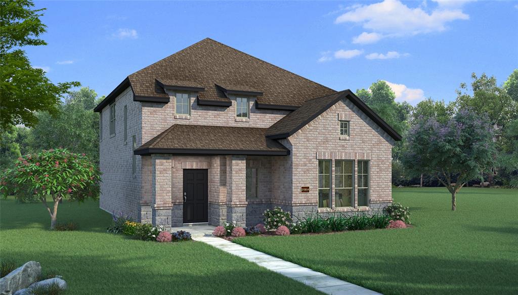 a front view of a house with a yard and trees