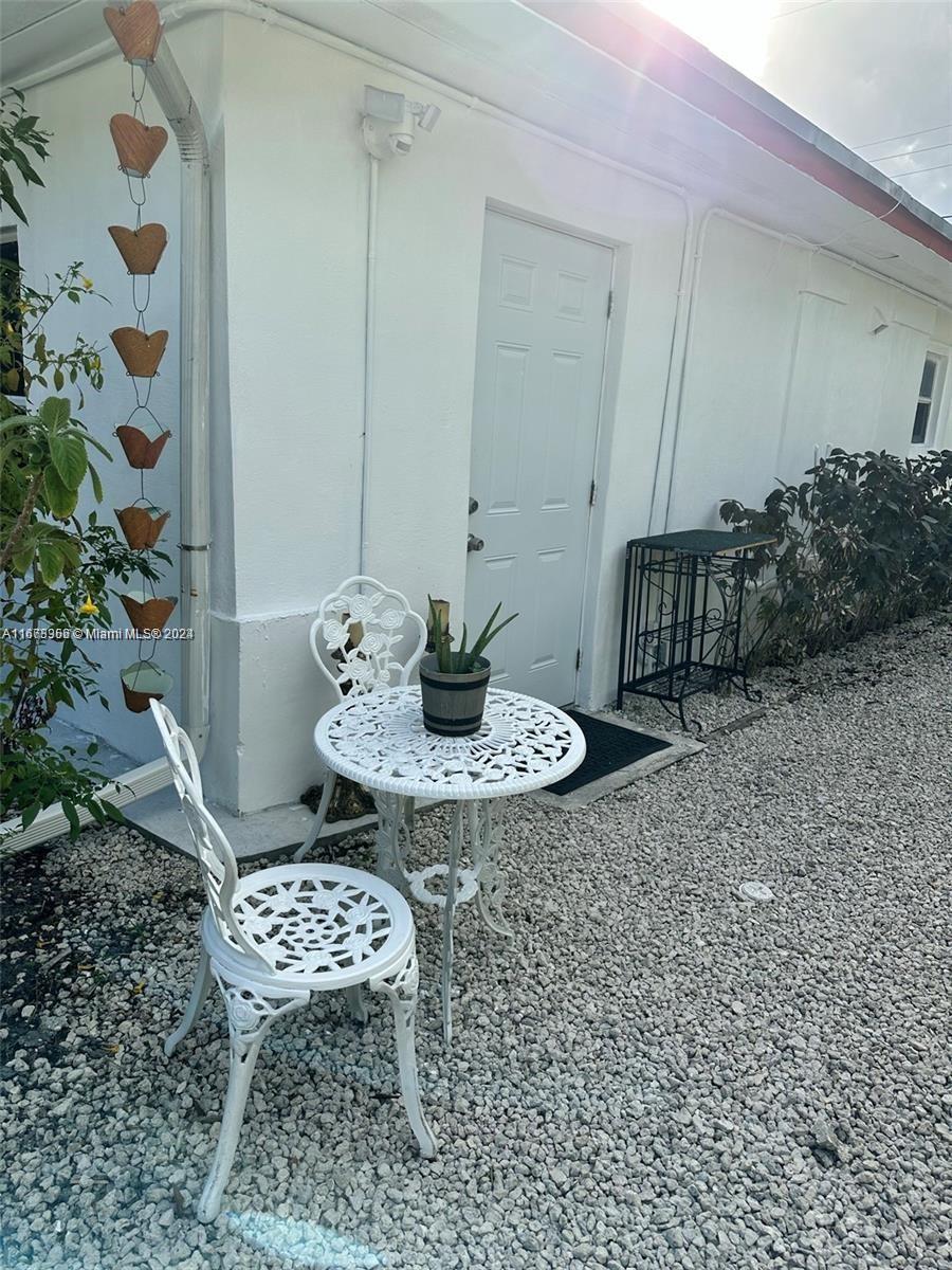 a table and chairs in a patio