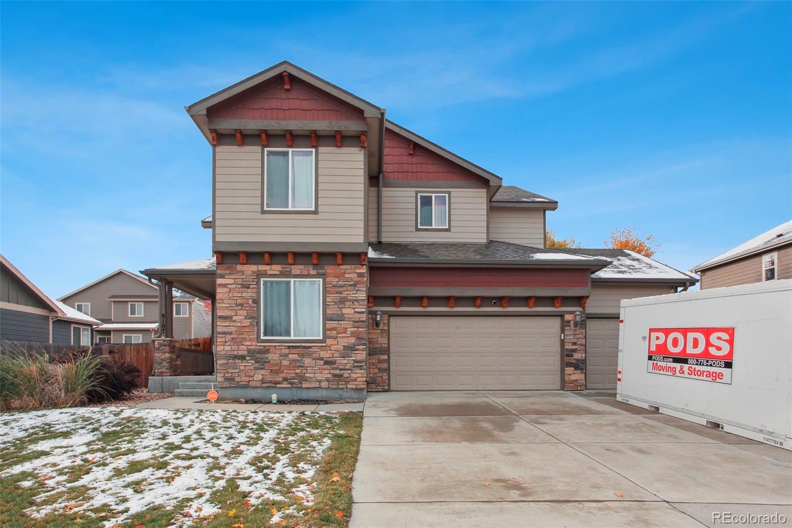 a front view of a house with a garage