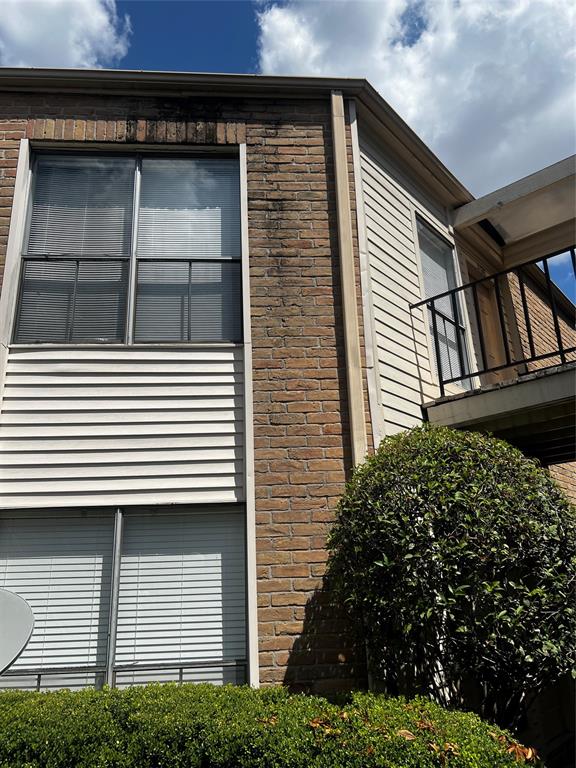 a view of a house with a door and a window