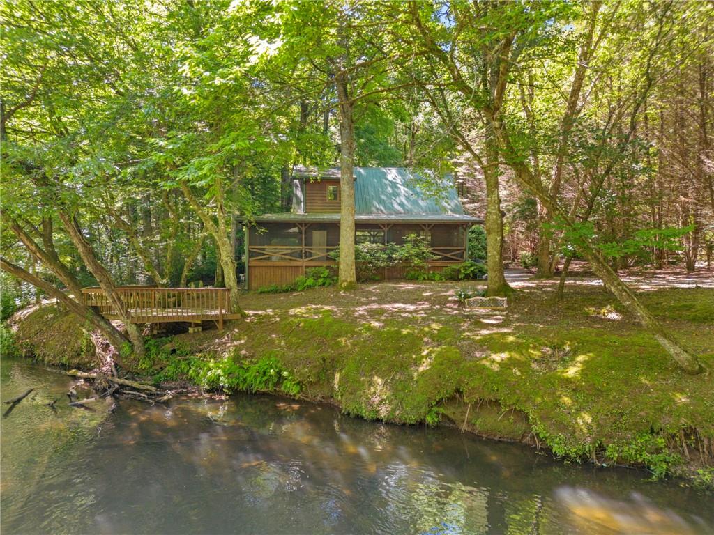 a view of a backyard with swimming pool