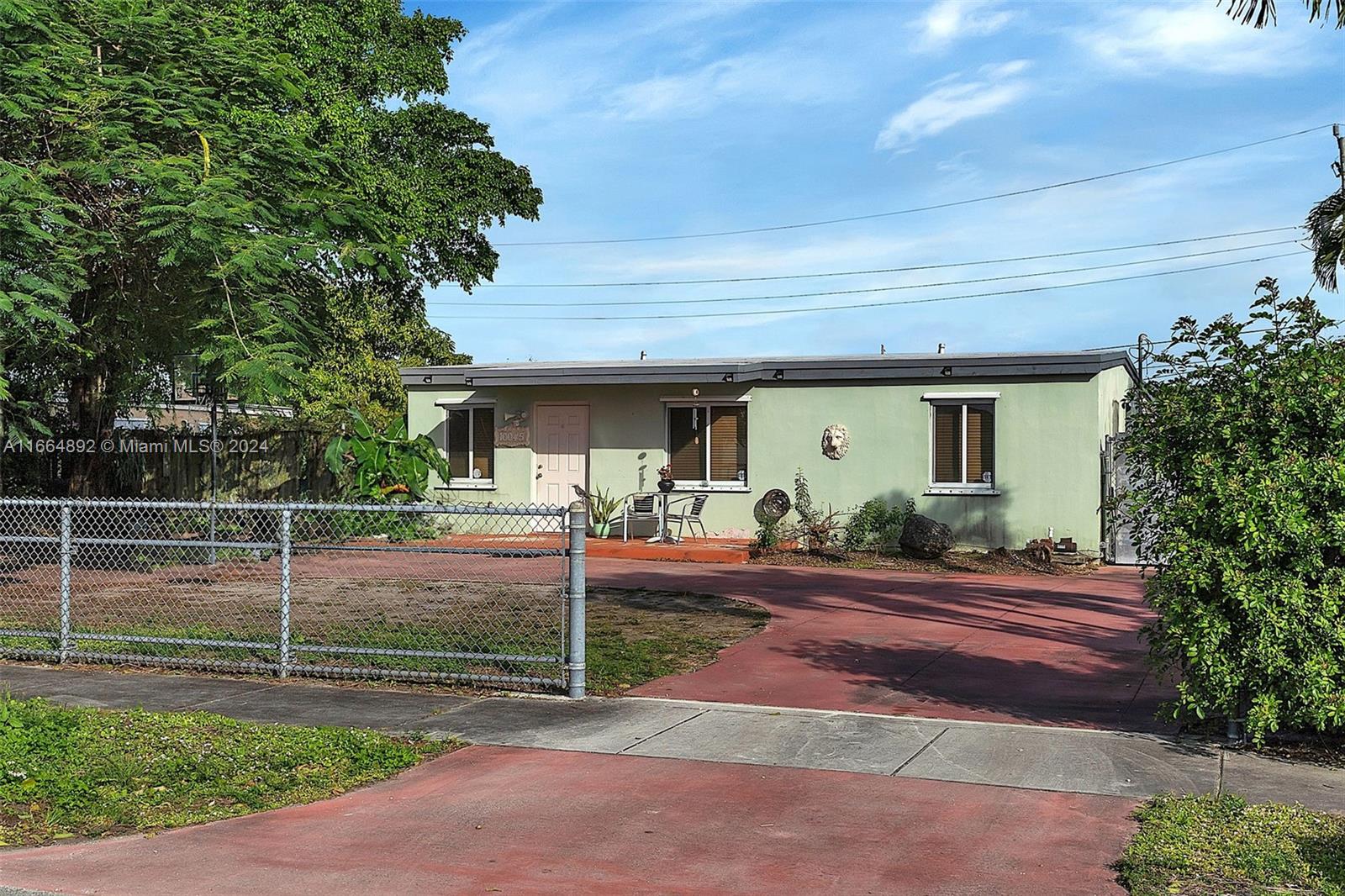 a house view with a backyard space