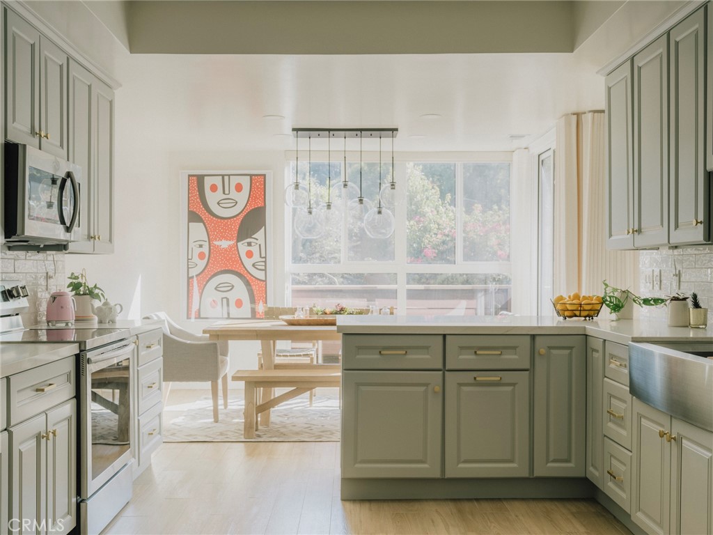 a kitchen with a sink and cabinets