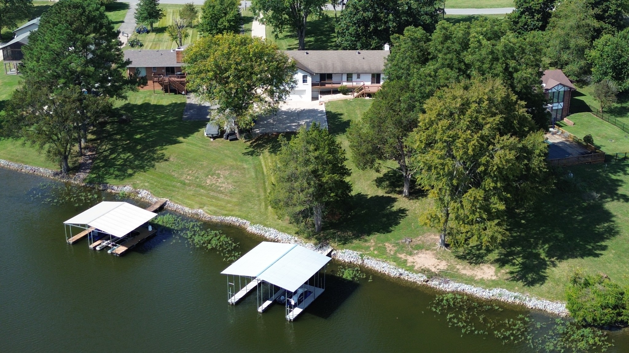 an aerial view of house with yard swimming pool and outdoor seating