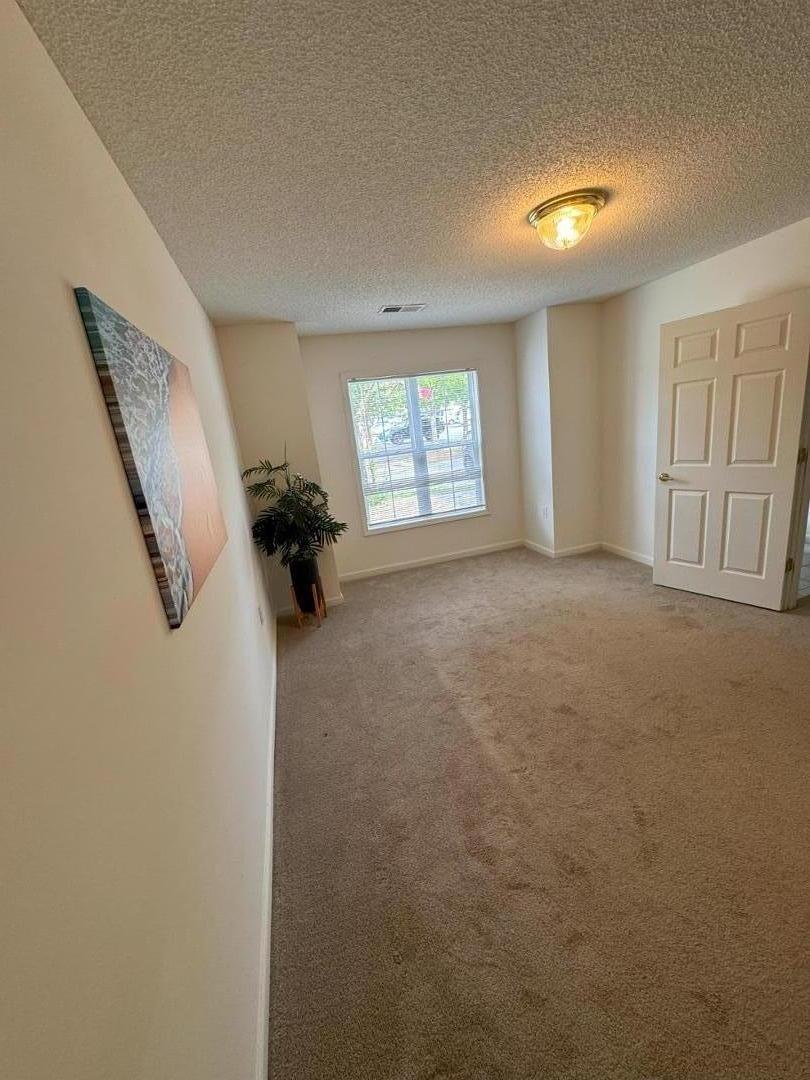 a view of a livingroom with furniture and windows