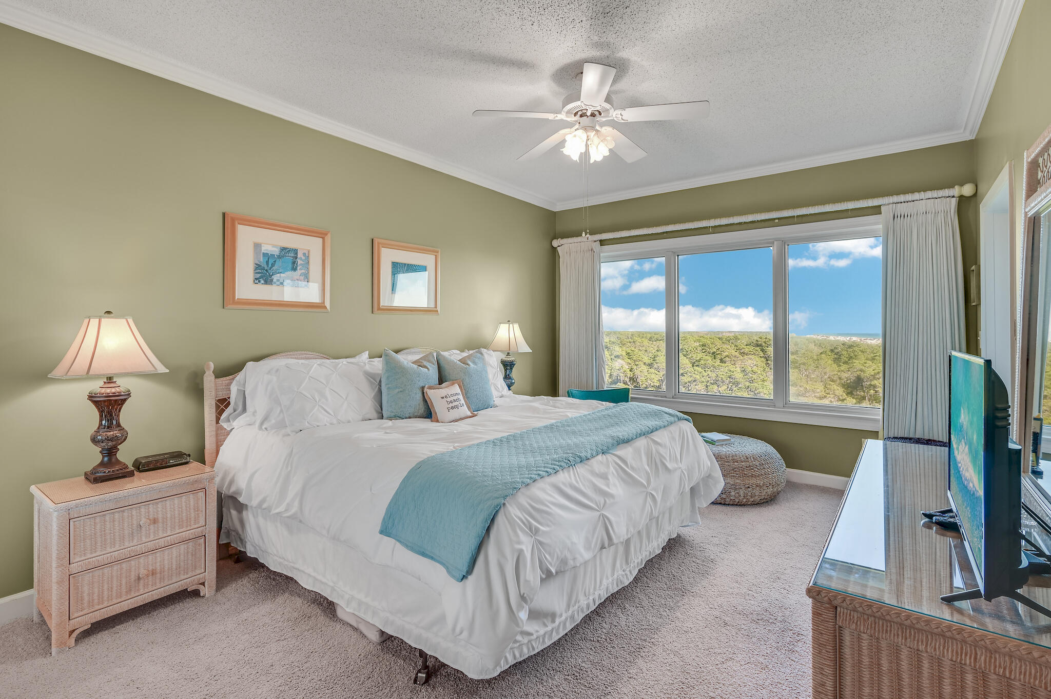 a spacious bedroom with a bed and a large window