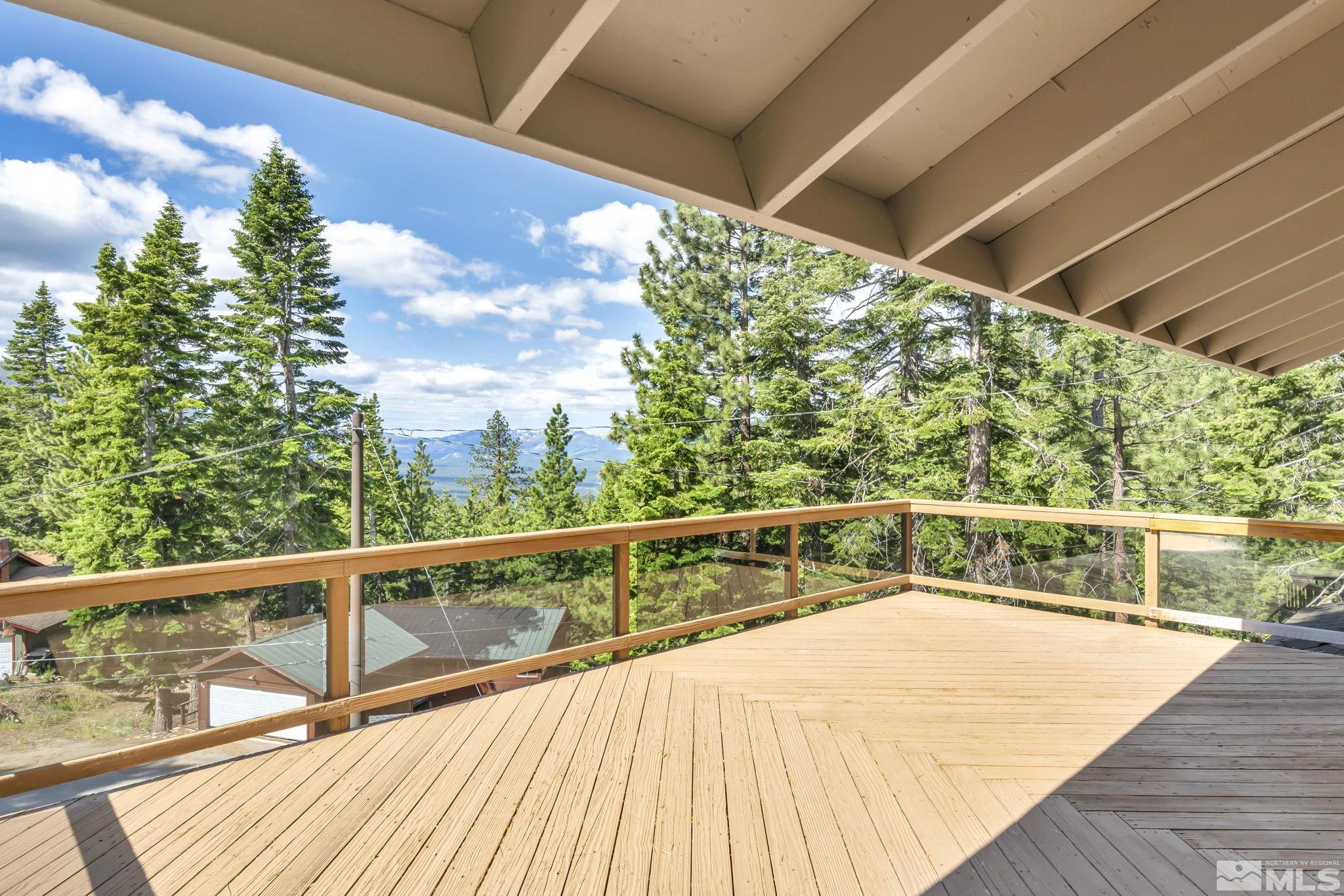 a view of balcony with wooden floor