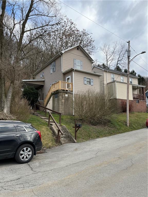 a view of a car park in front of house