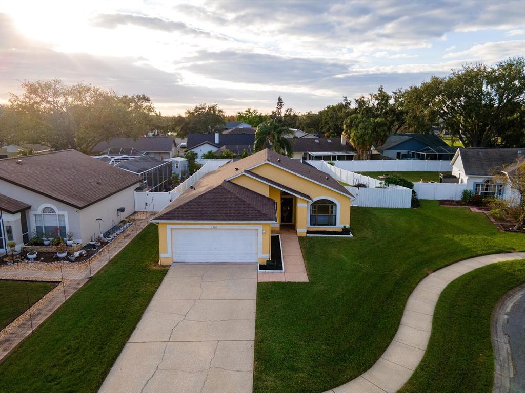 a aerial view of a house with a big yard