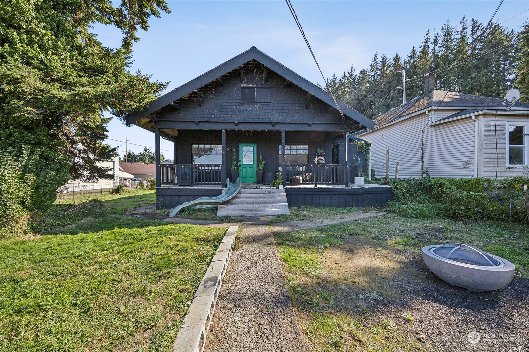 a front view of a house with garden