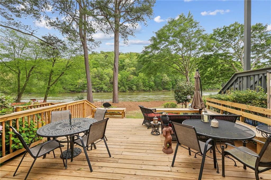 a view of backyard with seating area and outdoor seating