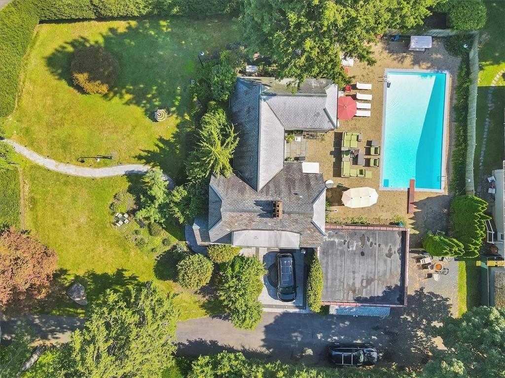 a aerial view of multi story residential apartment building with swimming pool