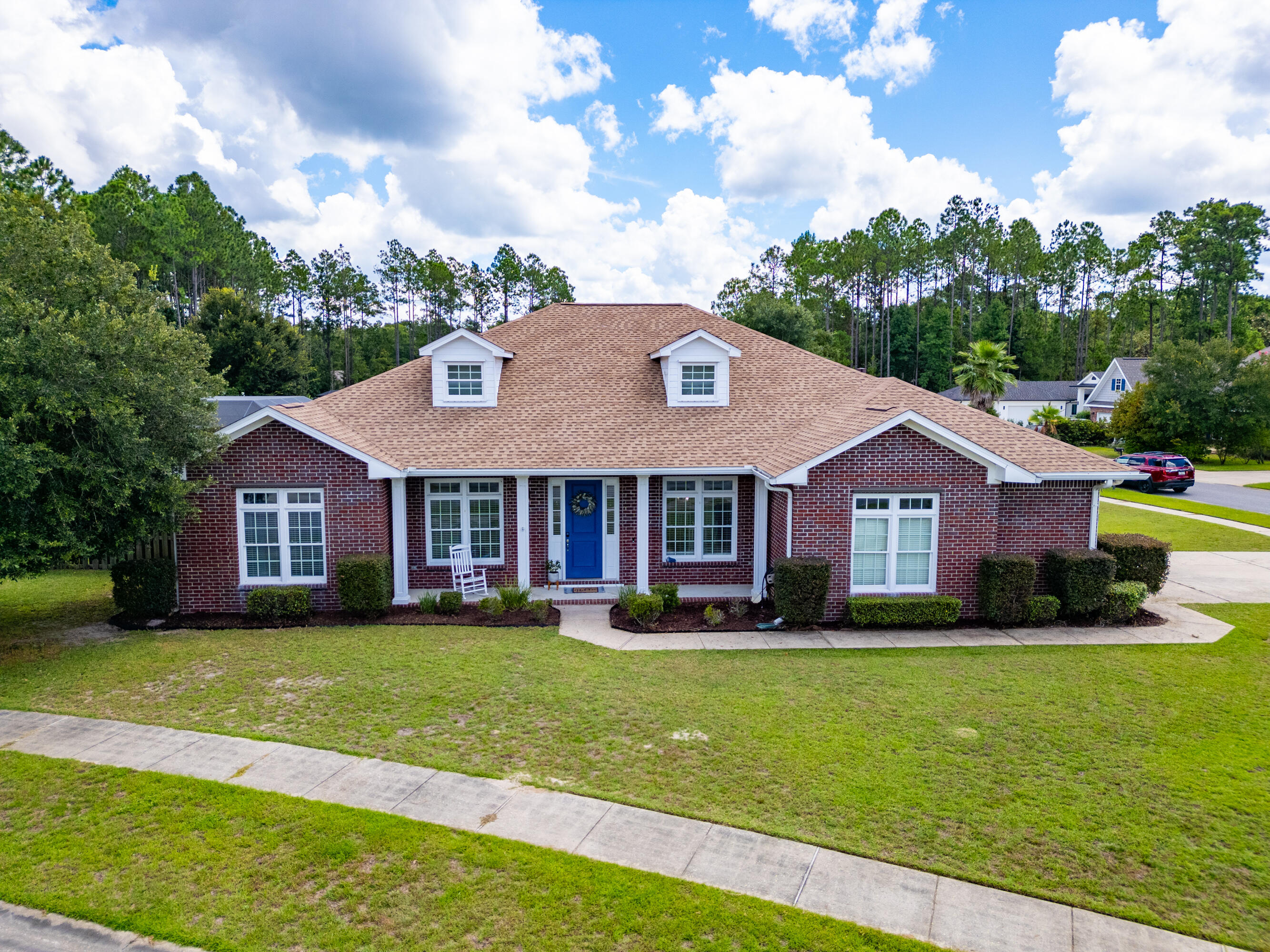 a front view of a house with a yard