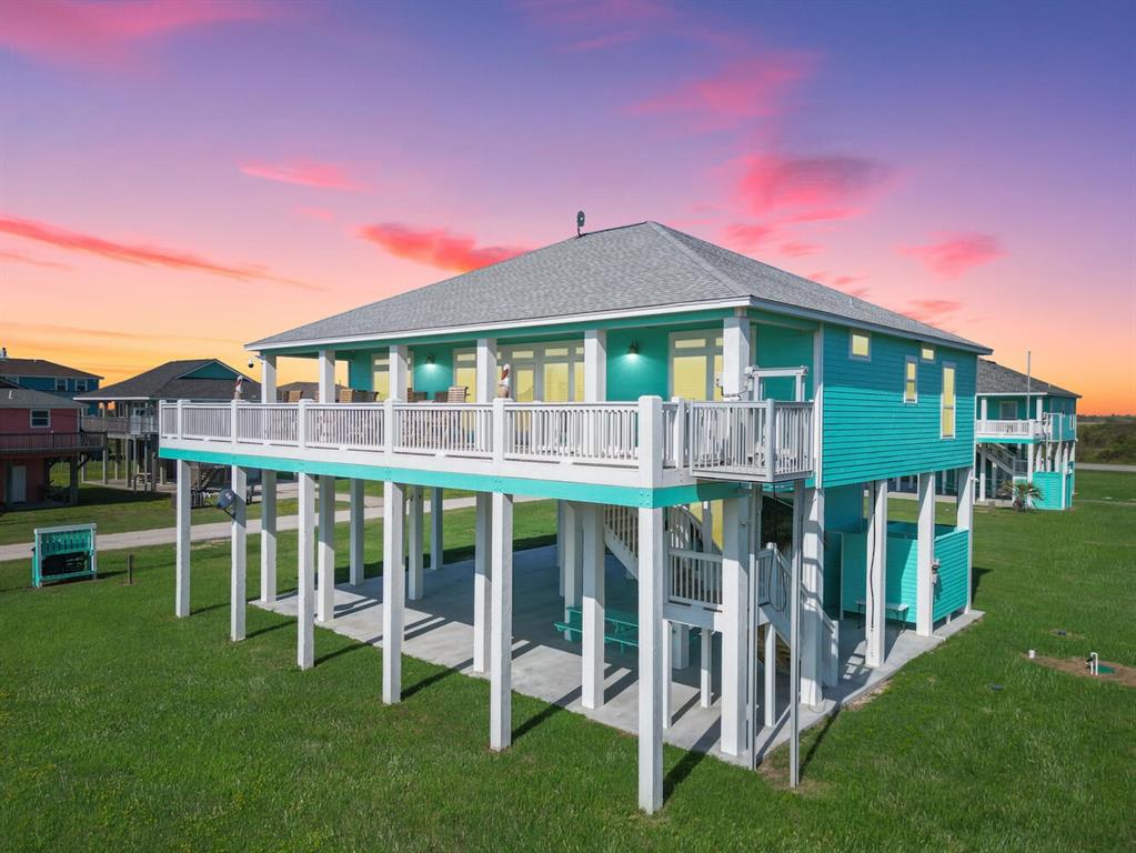 a front view of a house with a yard table and chairs