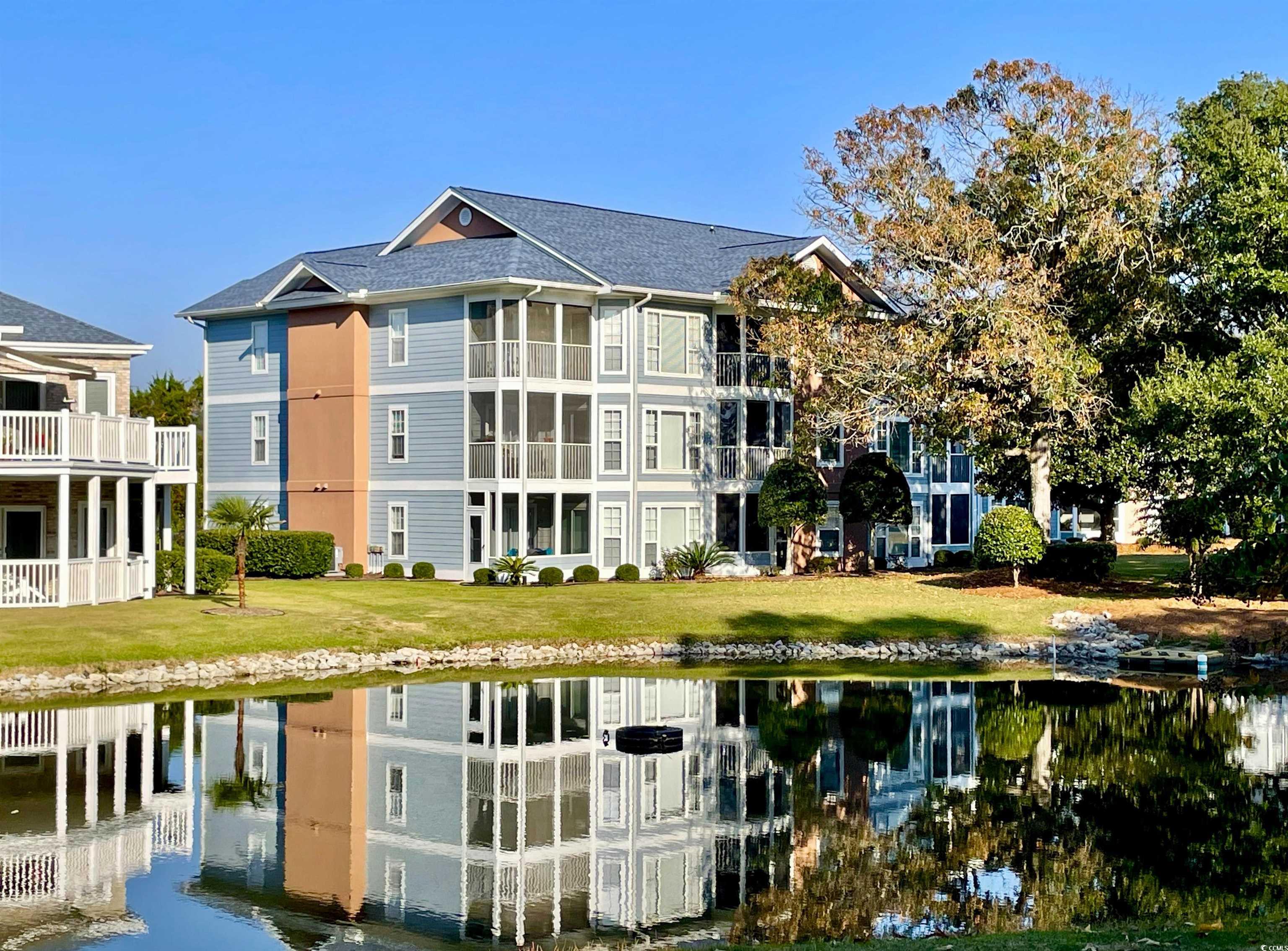 Rear view of house featuring a water view