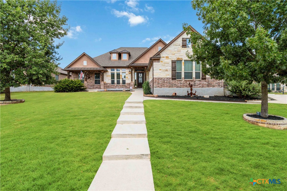 a front view of a house with a yard