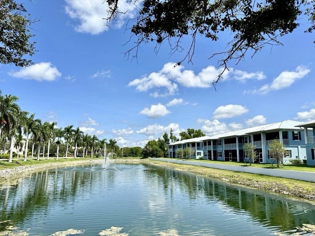 a view of a lake with a house in the background