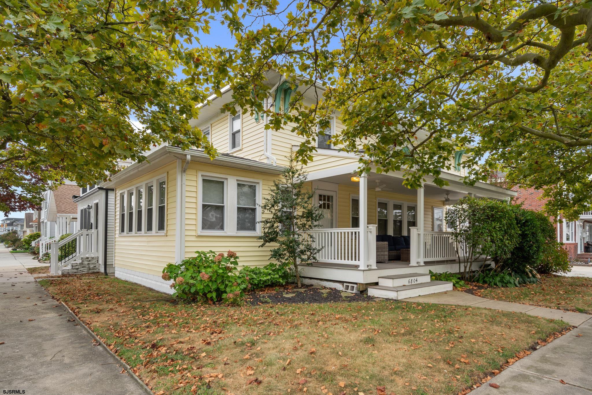 front view of a house with a tree