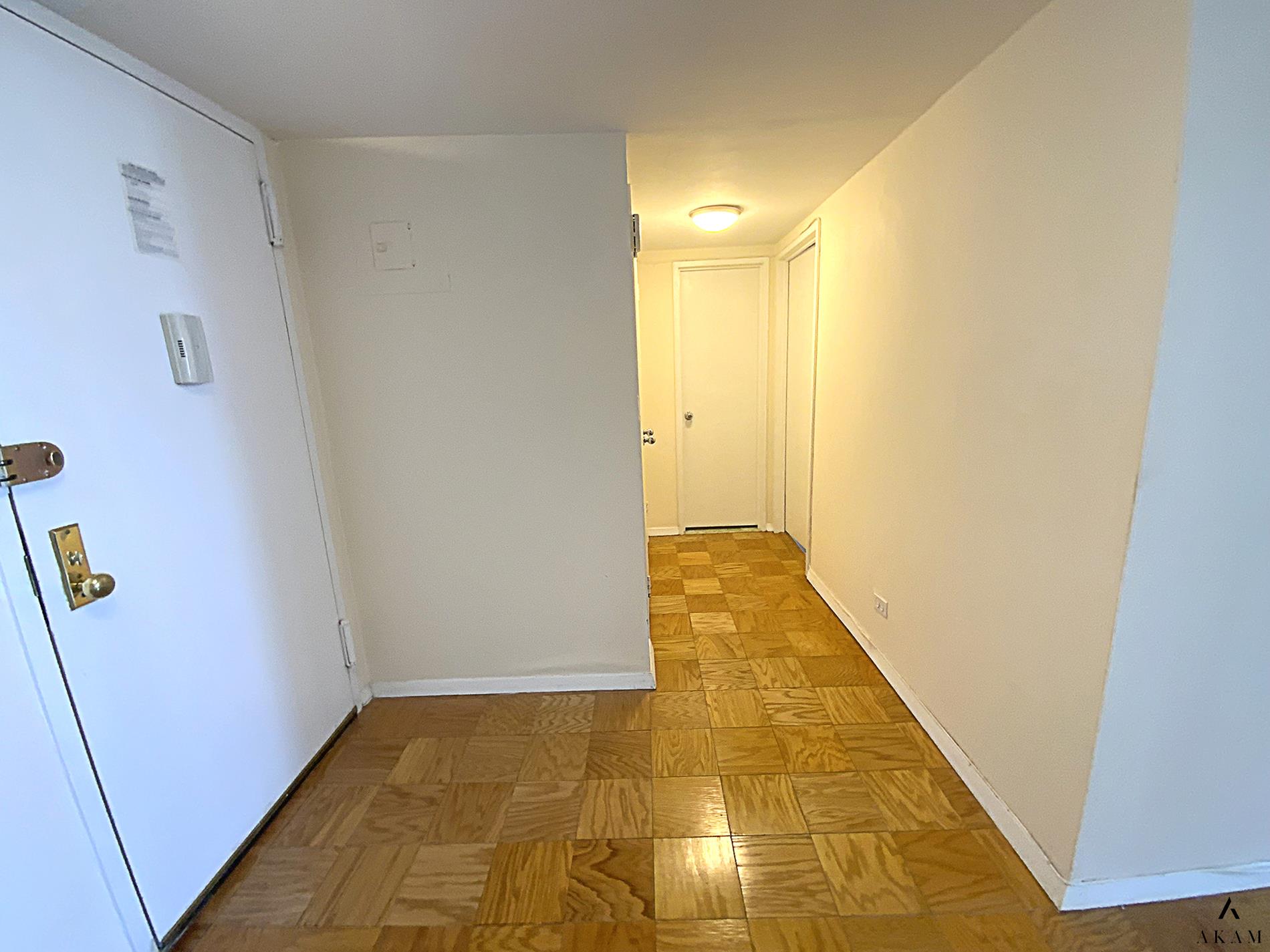 a view of hallway with wooden floor
