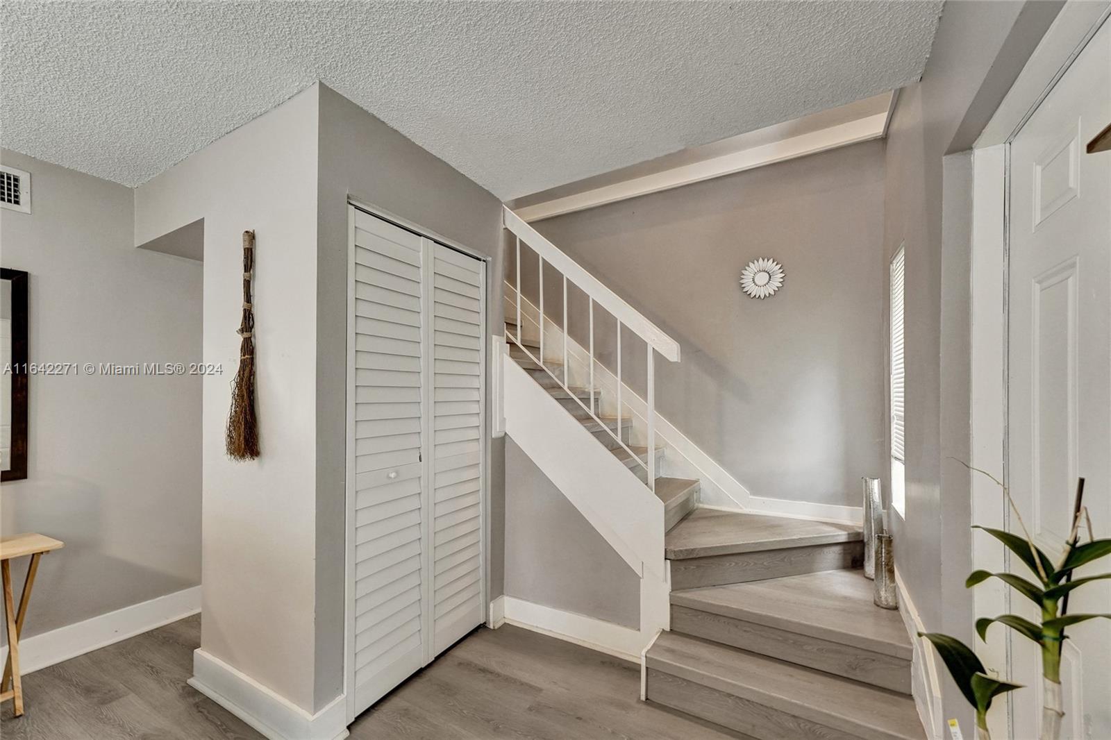 a view of entryway with stairs and wooden floor