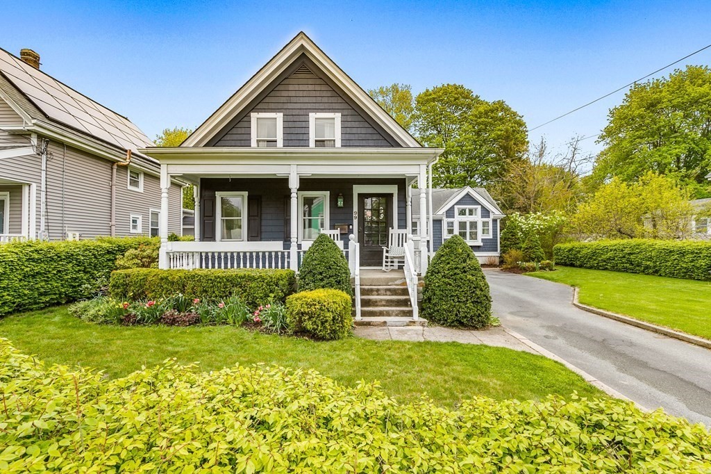 a front view of a house with garden