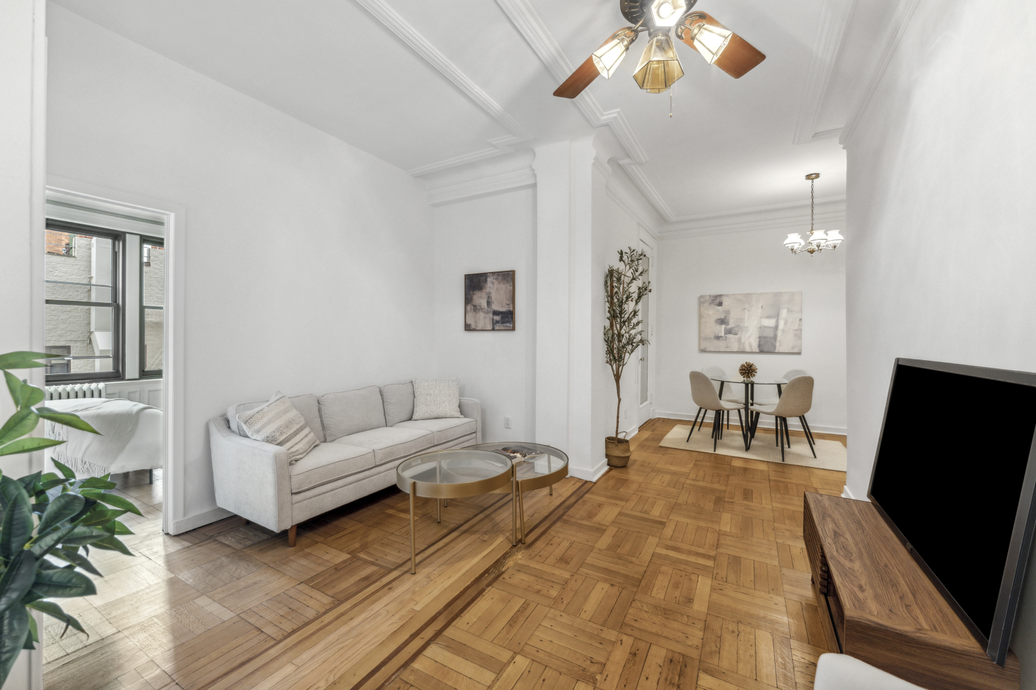 a living room with furniture and a flat screen tv