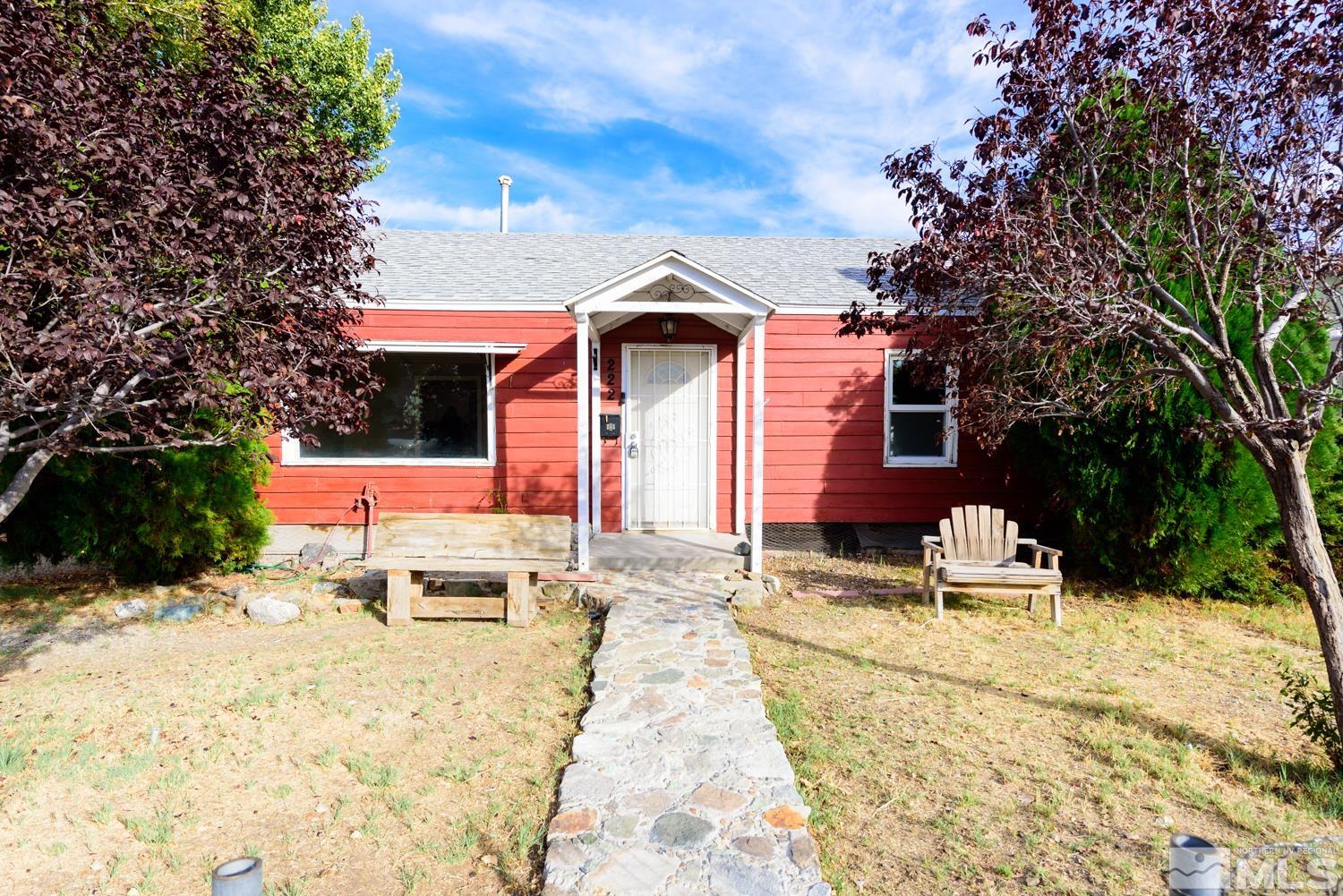 a view of a backyard with a patio