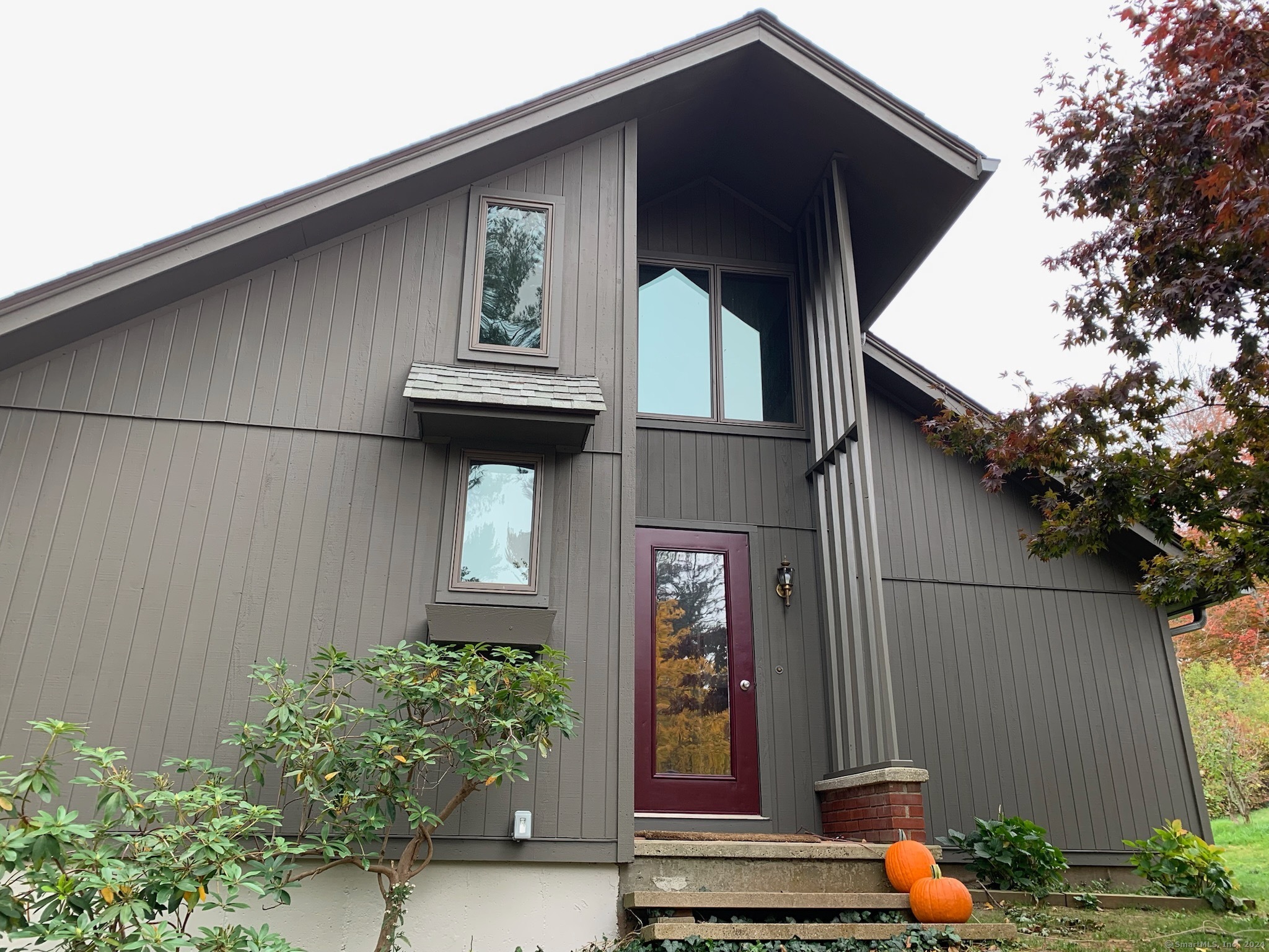 a front view of a house with garden