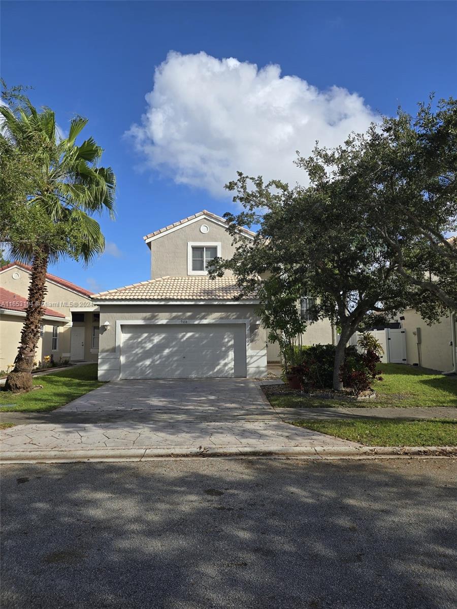 a view of a house with a yard