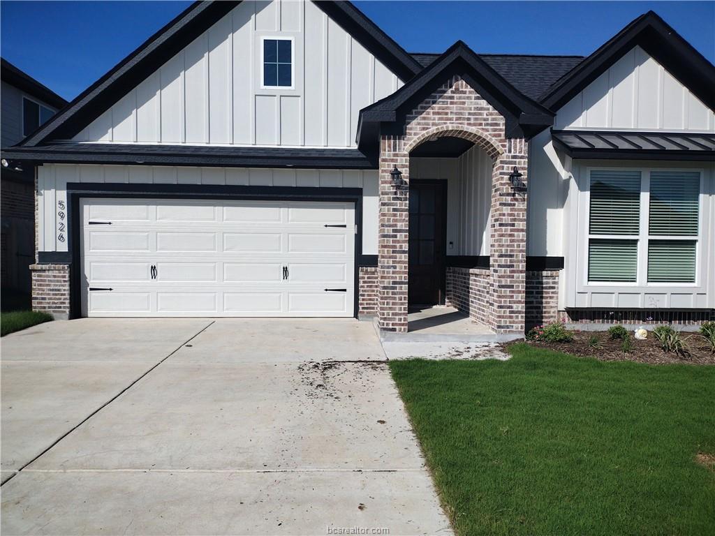 a view of a house with a small yard