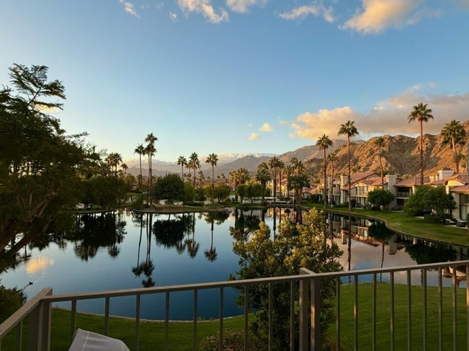 a view of a lake from a balcony