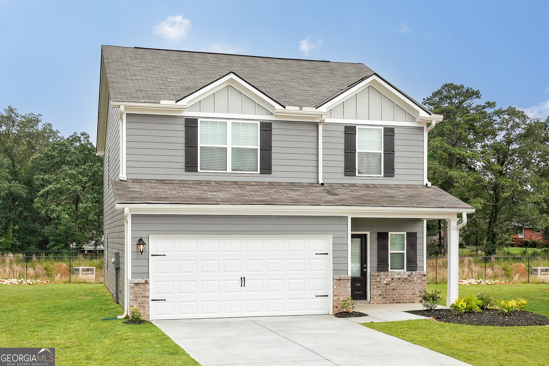 a view of a yard in front view of a house