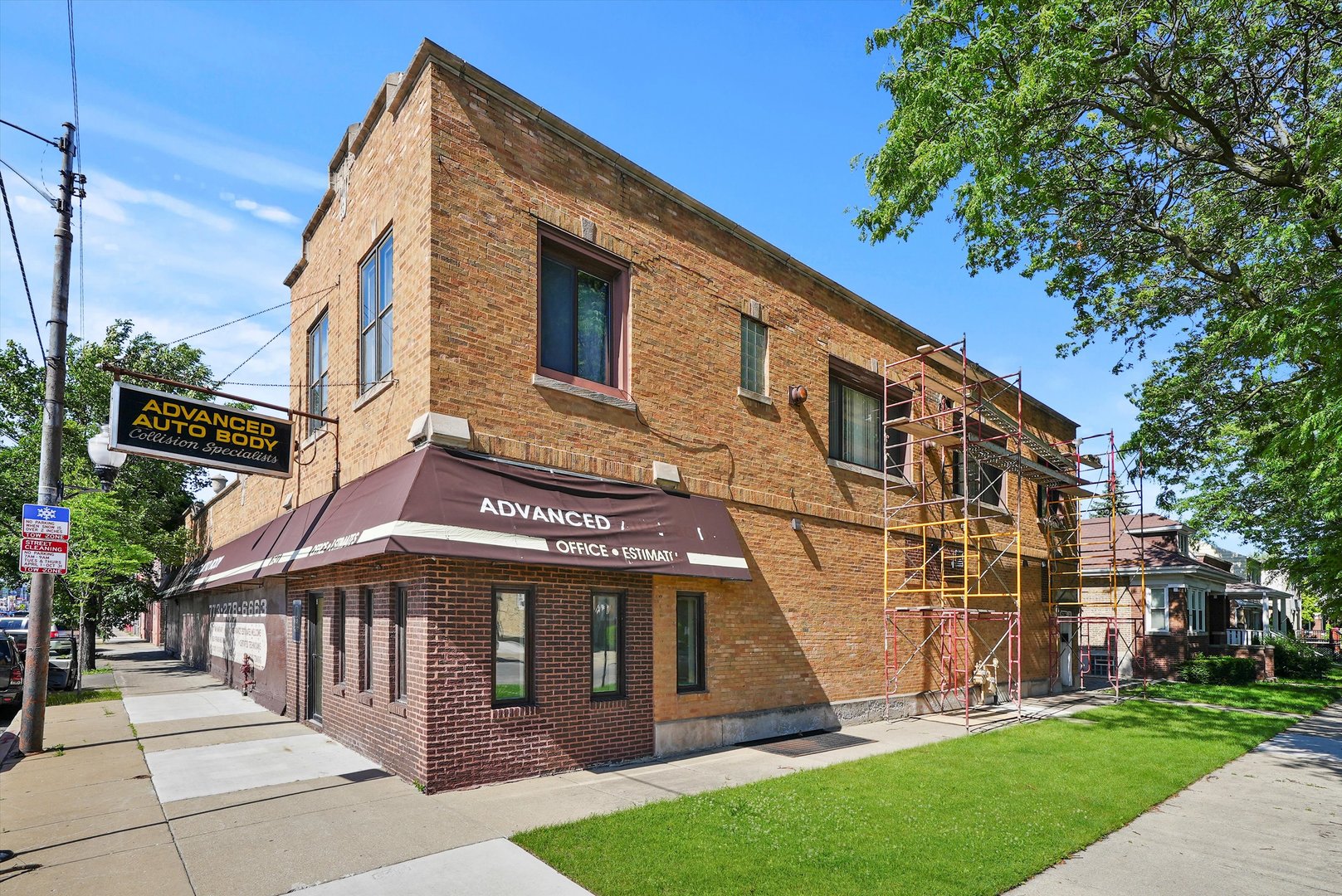 a view of a building with a yard