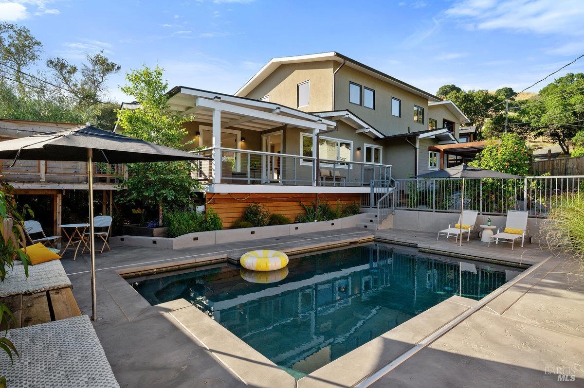 a view of a swimming pool with a patio