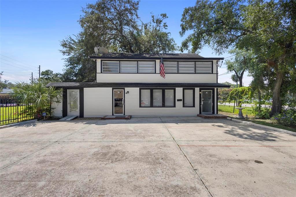 front view of a house with a garden