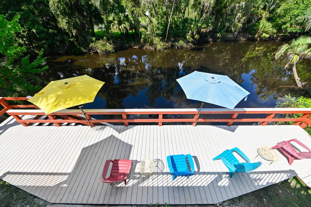 a view of a chairs and table on the deck