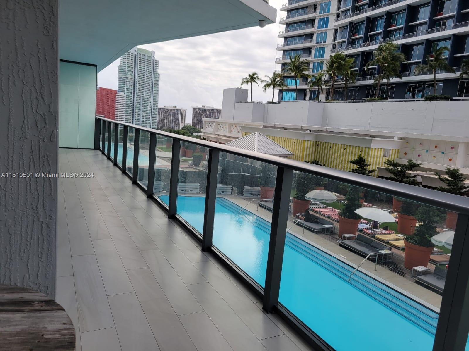 a balcony with wooden floor