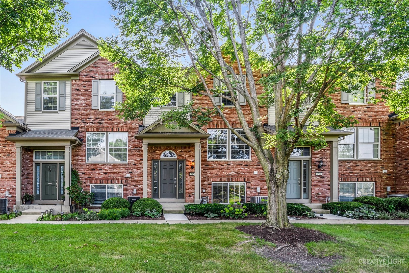 front view of a house with a yard