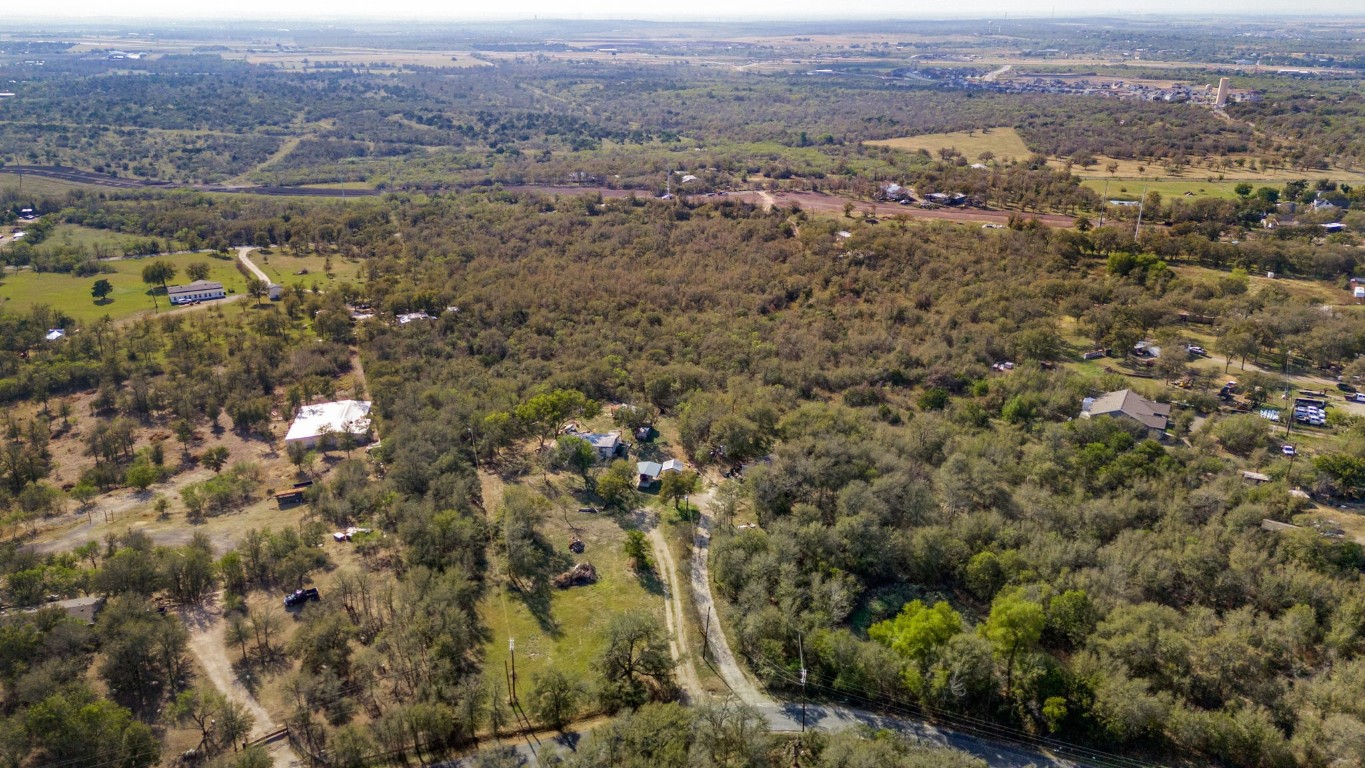 an aerial view of residential house and green space