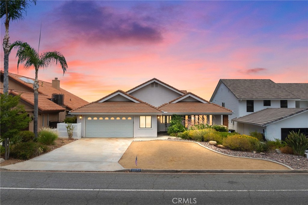 a house with palm tree in front of it