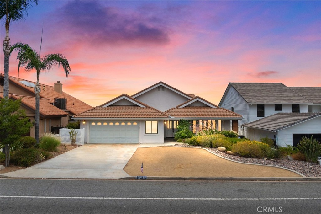 a house with palm tree in front of it