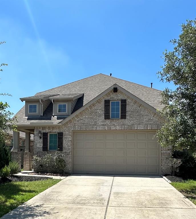 a front view of a house with yard