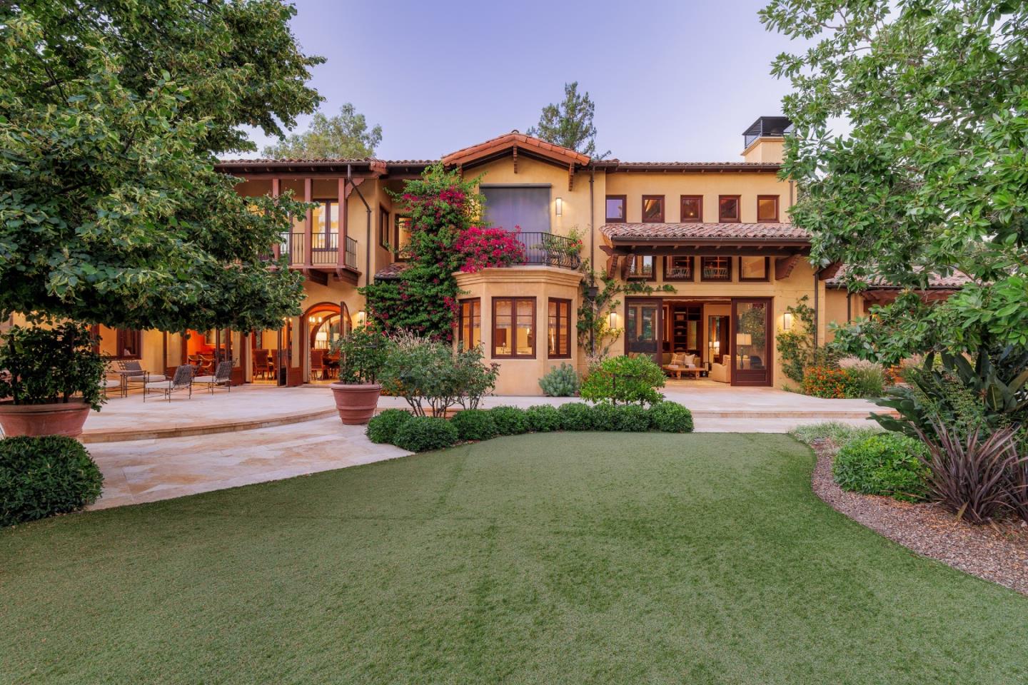 a front view of a house with a yard and porch