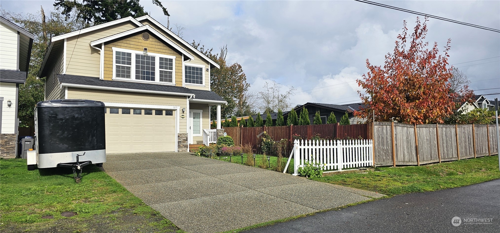 a front view of a house with a garden