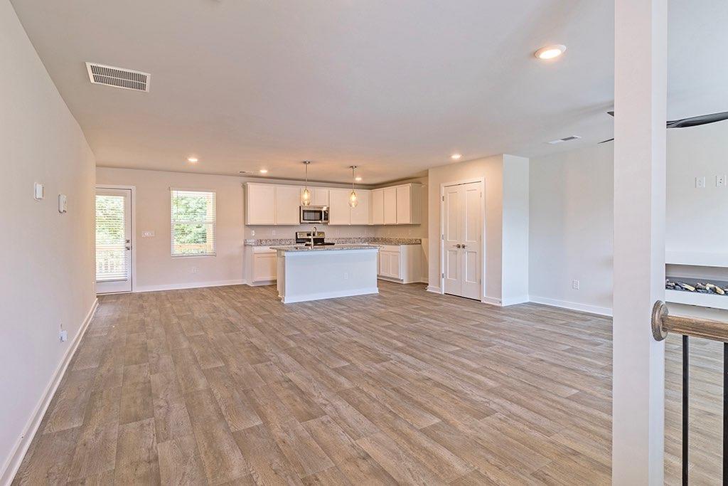 a view of kitchen with wooden floor