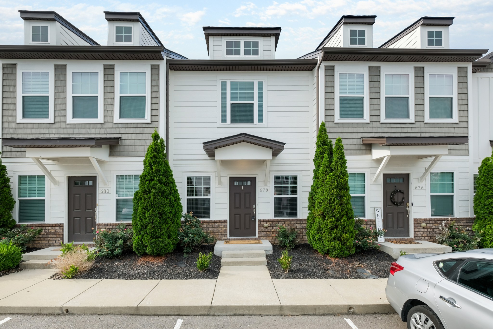 front view of a house with a yard