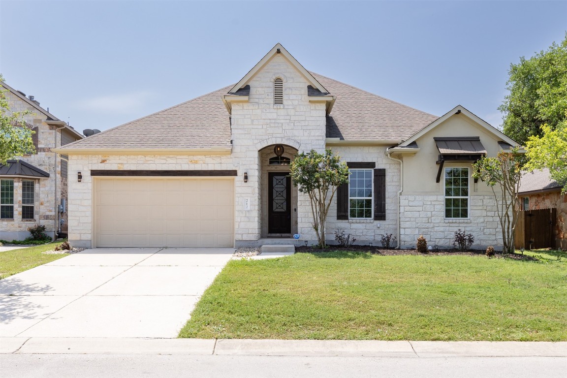 Gorgeous, white, chopped stone home with high ceilings and amazing space.