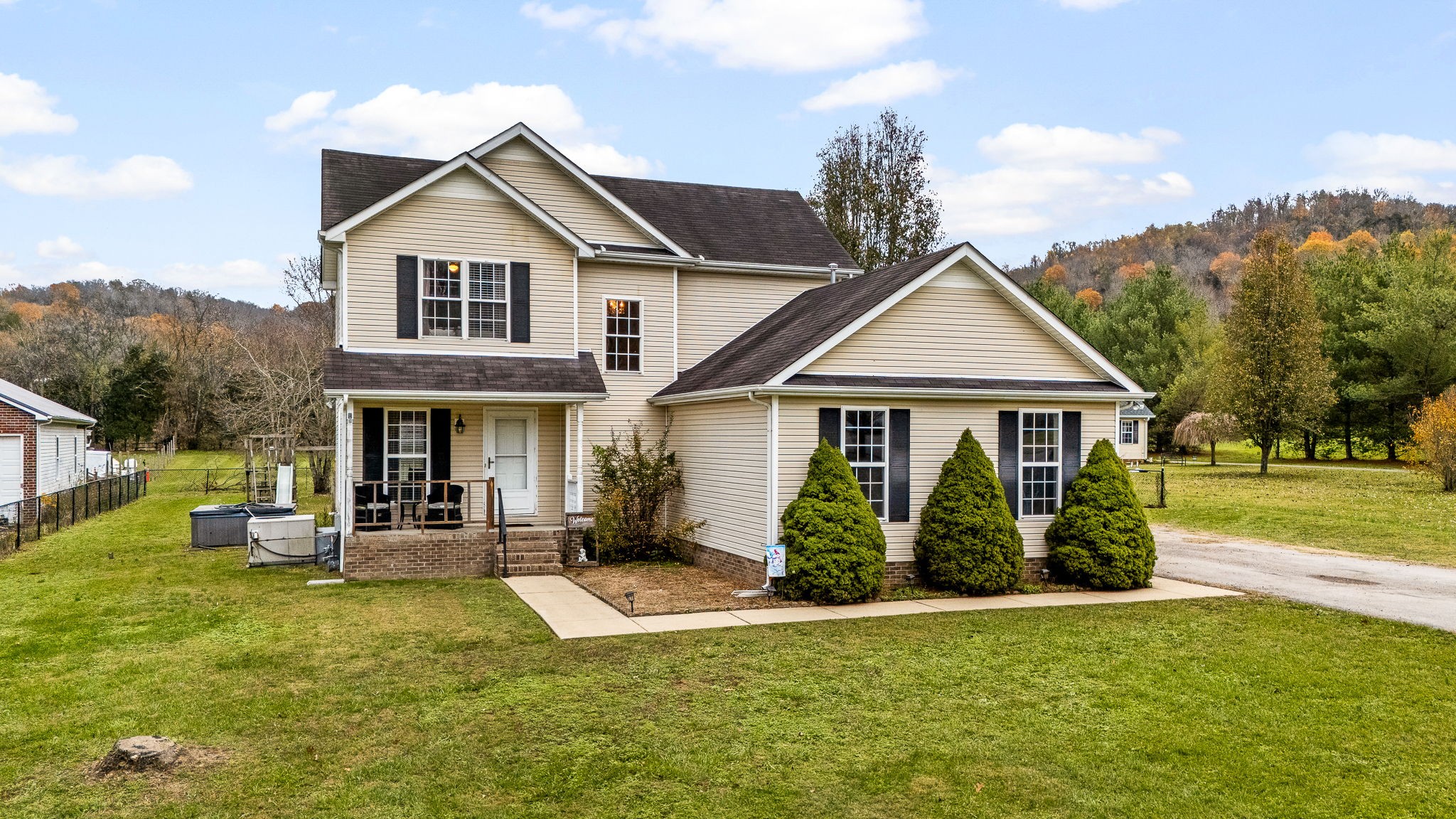 a front view of a house with garden