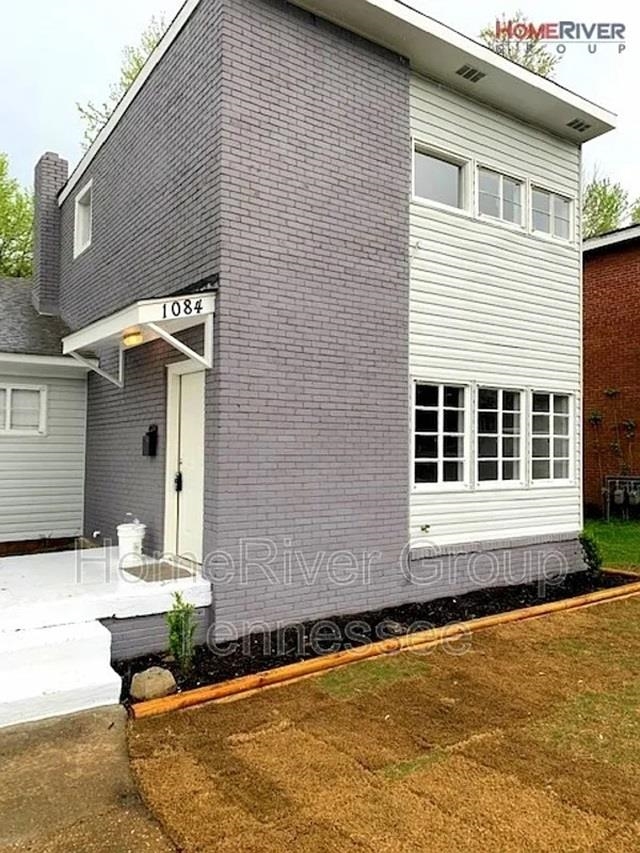 a front view of a house with swimming pool