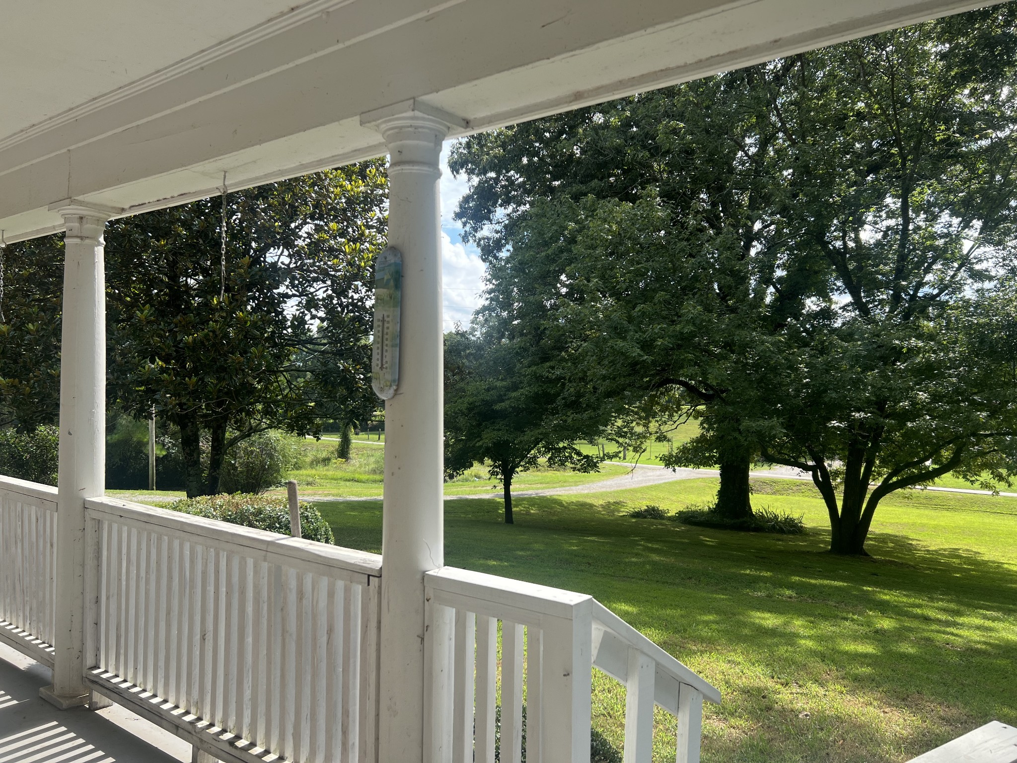 a view of a porch with a yard